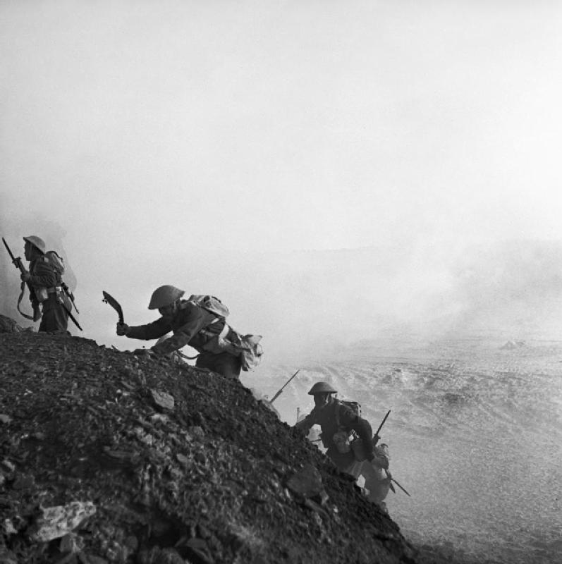 Ghurkas advance through a smokescreen up a steep slope in Tunisia 16 March 1943. NA1096 - The coins struck with WWII bullets collected from the battlefield…