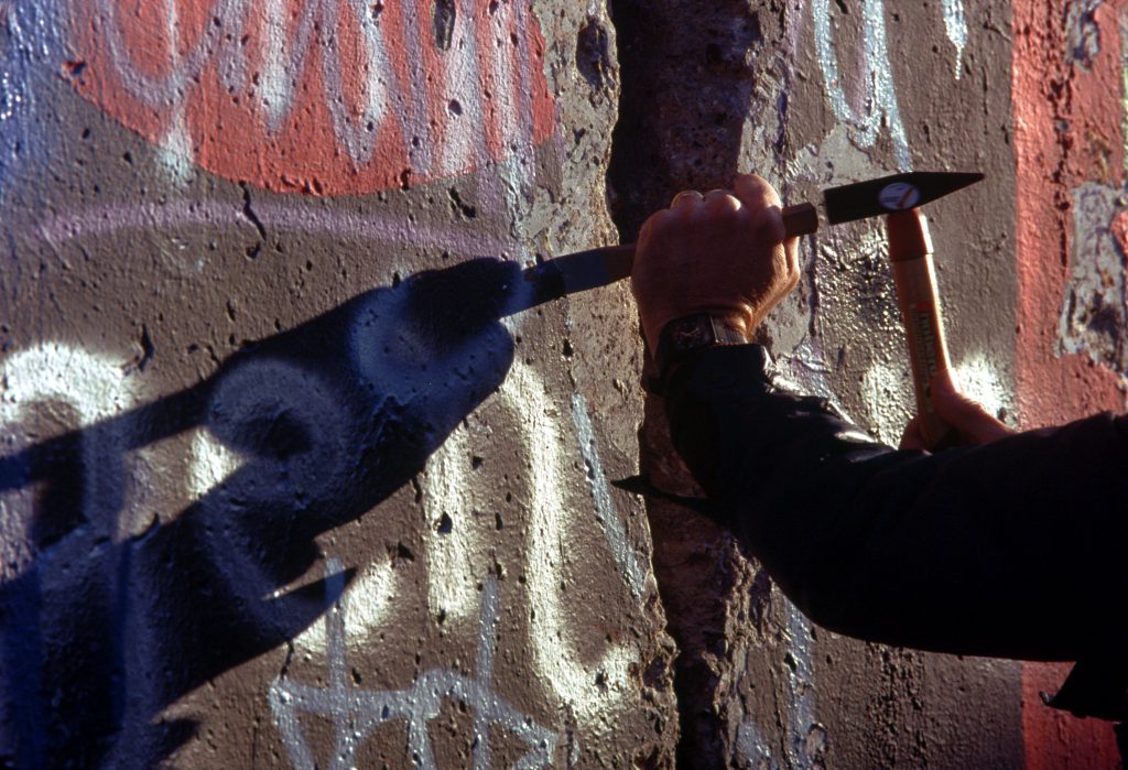 Chipping off a piece of the Berlin Wall 1024x699 - The Great Escape from East Berlin