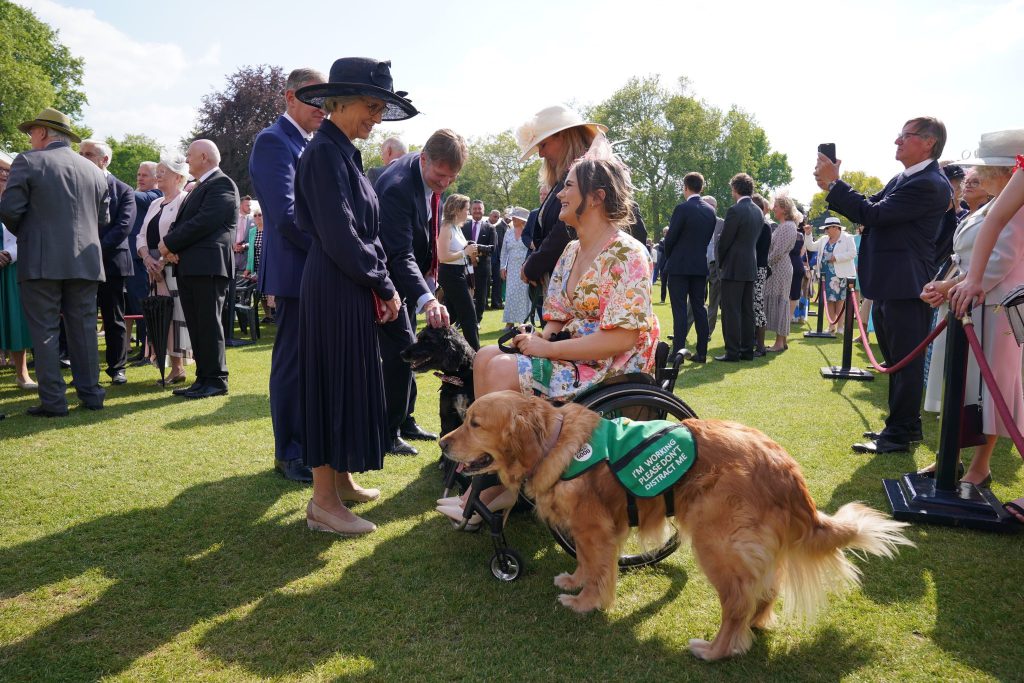 The Duchess of Gloucester greeted guests and dogs at the Royal Anniversary Garden Party